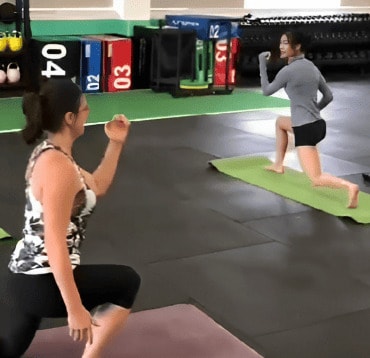 another trainer leading a class in yoga