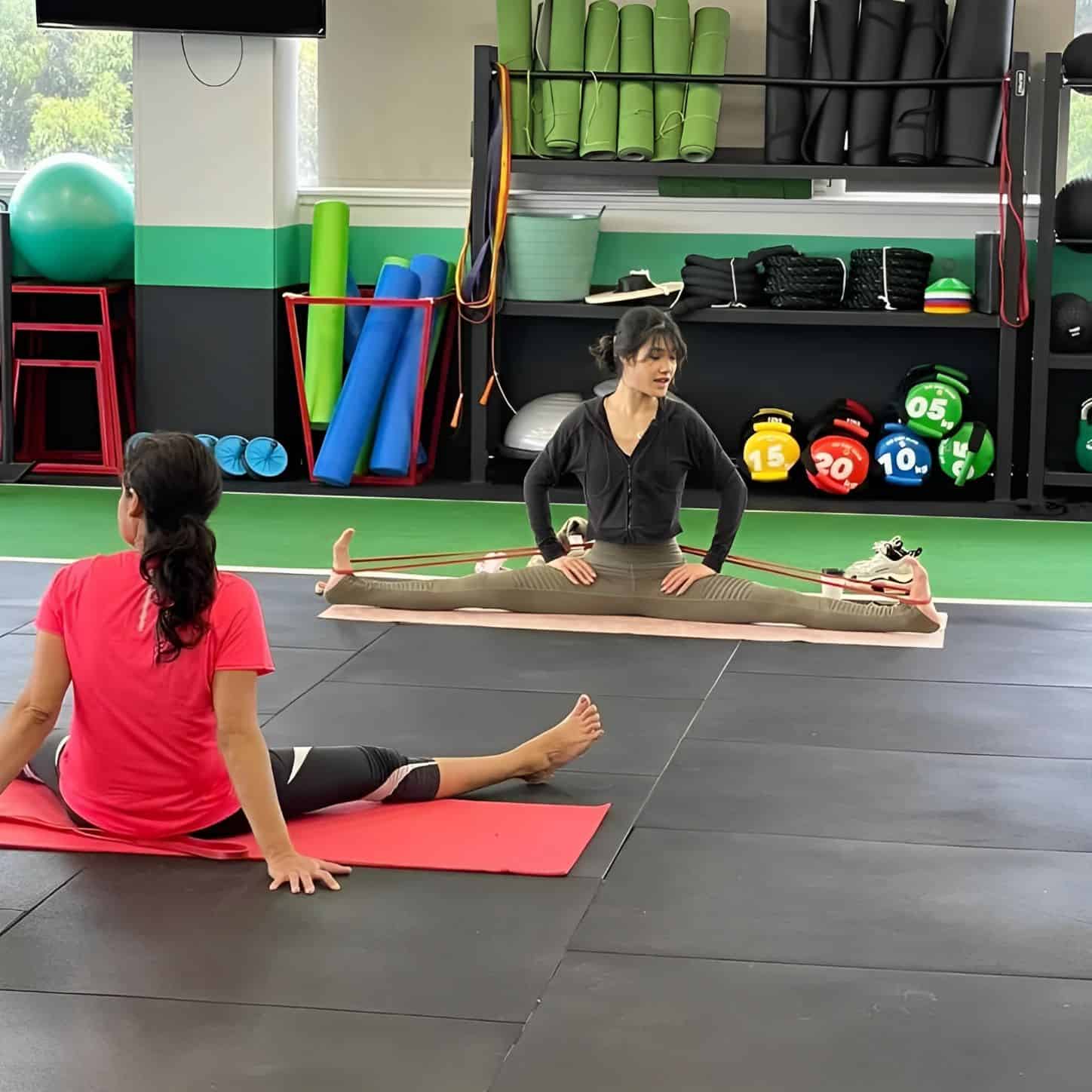 trainner leading a class in yoga